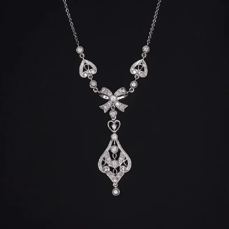 Drape-style necklaces-VINTAGE DIAMOND PENDANT BOW RIBBON NECKLACE 18K WHITE GOLD FILIGREE HEART DROP