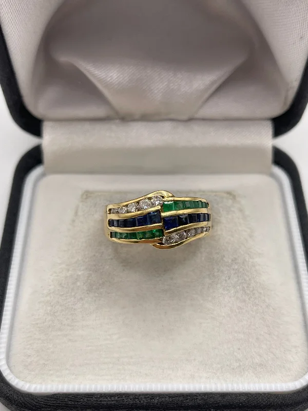 Fold band rings-18ct gold emerald, sapphire and diamond ring