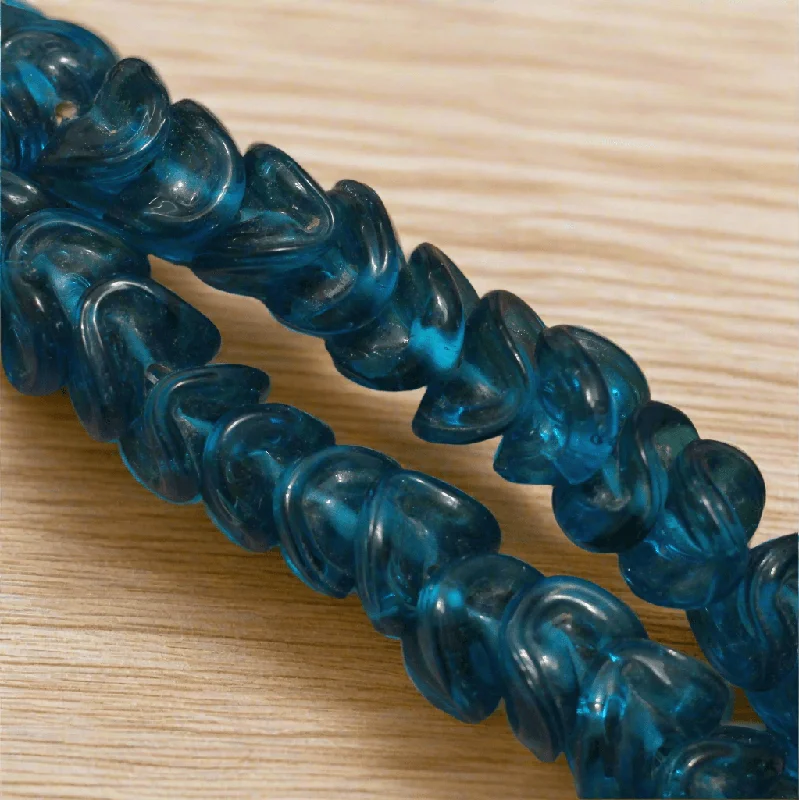 Aged bronze rings-1 string 14mm Twisty Glass Beads Light Blue