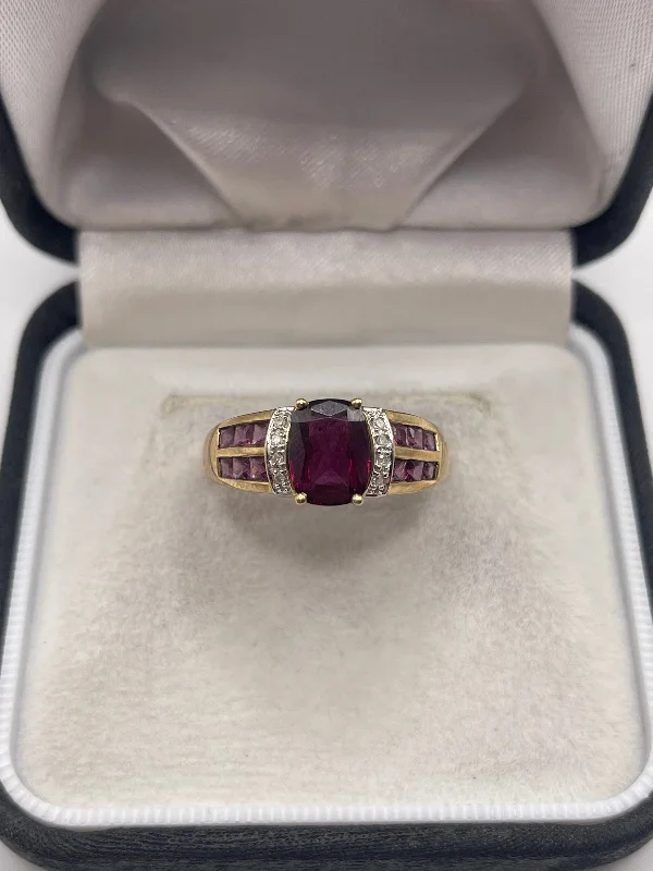 Layered metal rings-9ct gold garnet and diamond ring